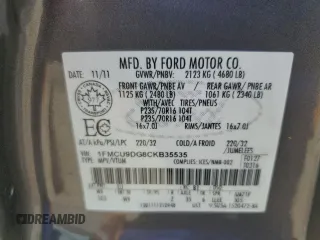 2012 Ford Escape XLT z VIN 1FMCU9DG8CKB35535, wystawiony jako Copart lot #60202675 z przebiegiem 205 750 mil mil oraz Szkoda całkowita • Salvage title. Historia ofert i sprzedaży dostępna na DreamBid. Obrazek 13.