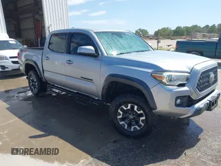 2018 Toyota Tacoma SR with VIN 3TMCZ5AN3JM170037, listed as a IAAI auction lot 42565385 with 157,450 mi miles and . Bid and sale history available at DreamBid. Image 1.
