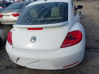 2014 Volkswagen Beetle 2.5L w/Sun with VIN 3VWJP7ATXEM628666, listed as a IAAI auction lot 41328014 with 70,990 mi miles and . Bid and sale history available at DreamBid. Image 17.