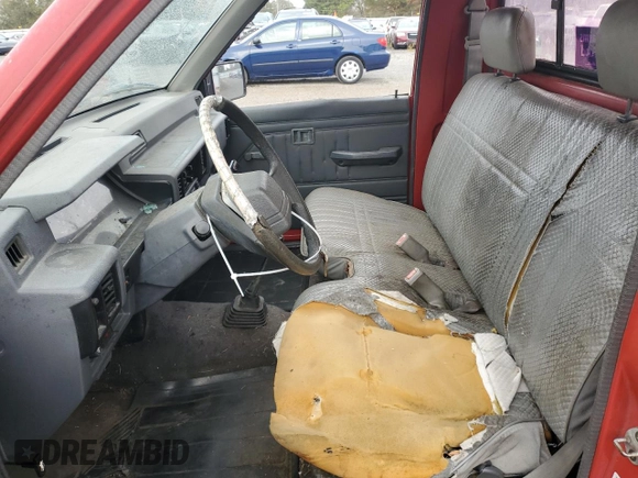 1991 Mitsubishi Mighty Max z VIN JA7FL24W2MP026041, wystawiony jako Copart lot #79159244 z przebiegiem 219 903 mil mil oraz Szkoda całkowita • Salvage title. Historia ofert i sprzedaży dostępna na DreamBid. Obrazek 7.