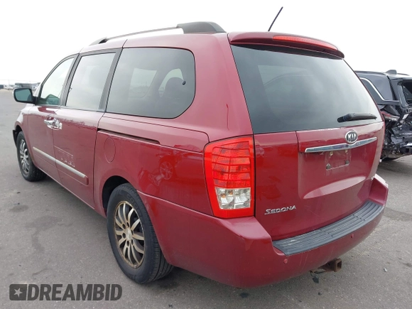 2012 Kia Sedona EX with VIN KNDMH4C76C6463143, listed as a IAAI auction lot 41990970 with 214,045 mi miles. Bid and sale history available at carsss.com. Image 3.