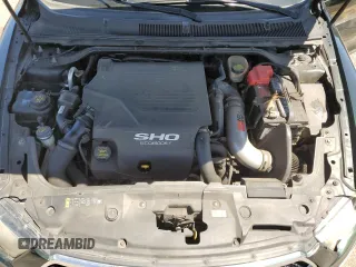 2013 Ford Taurus SHO z VIN 1FAHP2KT8DG173401, wystawiony jako Copart lot #54736195 z przebiegiem 176 507 mil mil oraz Szkoda całkowita • Salvage title. Historia ofert i sprzedaży dostępna na DreamBid. Obrazek 11.