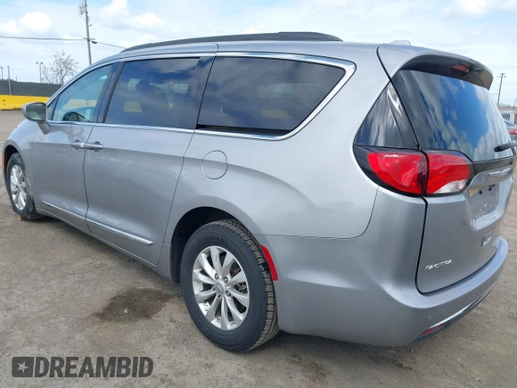 2017 Chrysler Pacifica Touring L with VIN 2C4RC1BG1HR803027, listed as a IAAI auction lot 41896775 with 112,896 mi miles and . Bid and sale history available at DreamBid. Image 3.