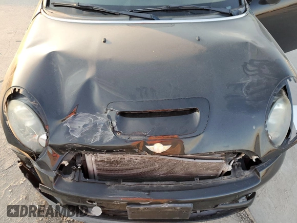 2013 MINI Coupe S z VIN WMWSX3C57DT408719, wystawiony jako Copart lot #75440574 z przebiegiem Nie podano mil oraz Szkoda całkowita • Salvage title. Historia ofert i sprzedaży dostępna na DreamBid. Obrazek 11.