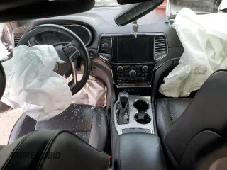 2020 Jeep Grand Cherokee Overland with VIN 1C4RJFCG3LC251579, listed as a Copart auction lot 70312594 with 59,656 mi miles and Salvage Title. Bid and sale history available at carsss.com. Image 8.