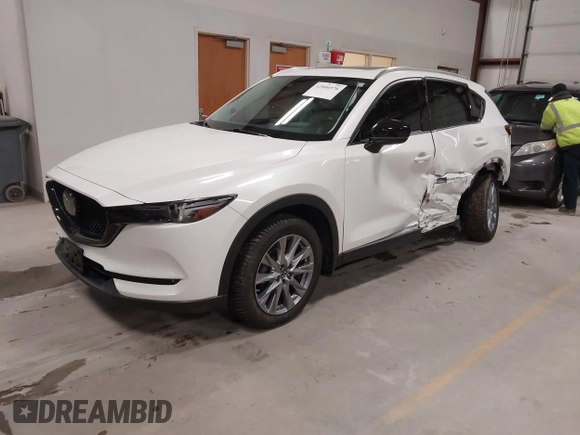 2020 Mazda CX-5 Grand Touring with VIN JM3KFBDM6L1828611, listed as a IAAI auction lot 42006976 with 59,939 mi miles and . Bid and sale history available at DreamBid. Image 2.
