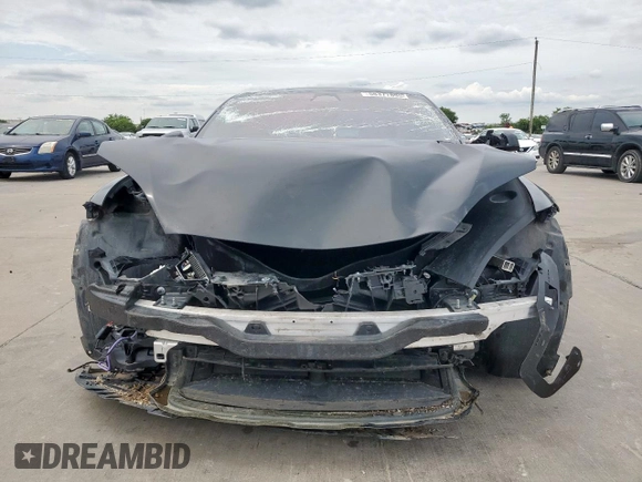 2023 Tesla Model S with VIN 5YJSA1E59PF512318, listed as a Copart auction lot 58377895 with 34,402 mi miles and Salvage title. Bid and sale history available at DreamBid. Image 5.