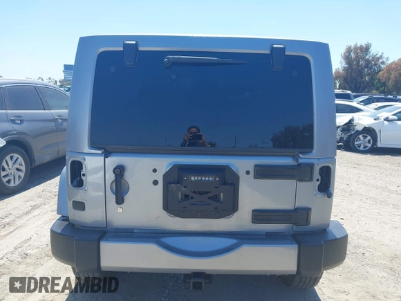 2018 Jeep Wrangler Unlimited Sport S with VIN 1C4HJWDG5JL839703, listed as a IAAI auction lot 42140205 with 61,604 mi miles and . Bid and sale history available at DreamBid. Image 17.