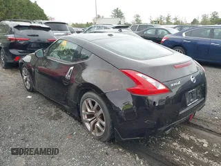 2013 Nissan 370Z with VIN JN1AZ4EH5DM881845, listed as a IAAI auction lot 41962079 with 64,420 mi miles. Bid and sale history available at carsss.com. Image 3.
