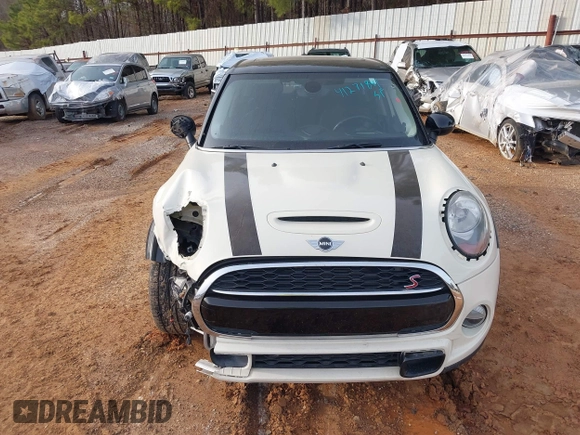 2015 MINI Hardtop 4 Door S z VIN WMWXU3C50F2B59450, wystawiony jako IAAI lot #41271841 z przebiegiem 70 719 mil mil oraz . Historia ofert i sprzedaży dostępna na DreamBid. Obrazek 13.