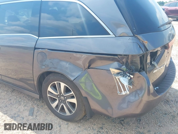 2015 Honda Odyssey Touring Elite with VIN 5FNRL5H95FB127156, listed as a IAAI auction lot 42618059 with 160,074 mi miles and . Bid and sale history available at DreamBid. Image 6.