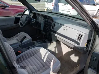 1995 Jeep Grand Cherokee Laredo with VIN 1J4GZ58SXSC676393, listed as a IAAI auction lot 41943464 with 244,317 mi miles. Bid and sale history available at carsss.com. Image 5.