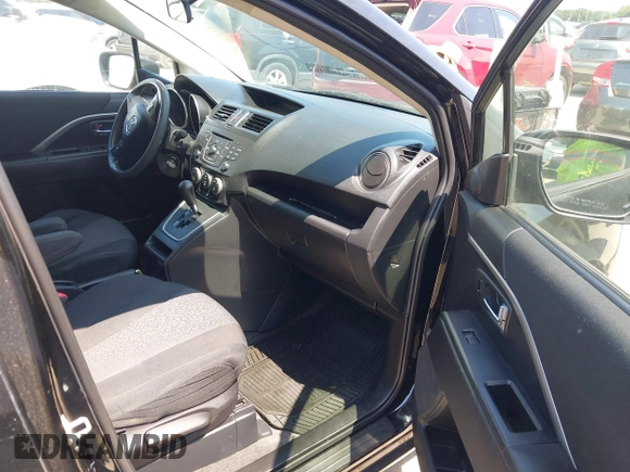 2012 Mazda 5 Sport z VIN JM1CW2BL0C0142657, wystawiony jako IAAI lot #42389495 z przebiegiem 107 790 mil mil oraz . Historia ofert i sprzedaży dostępna na DreamBid. Obrazek 5.