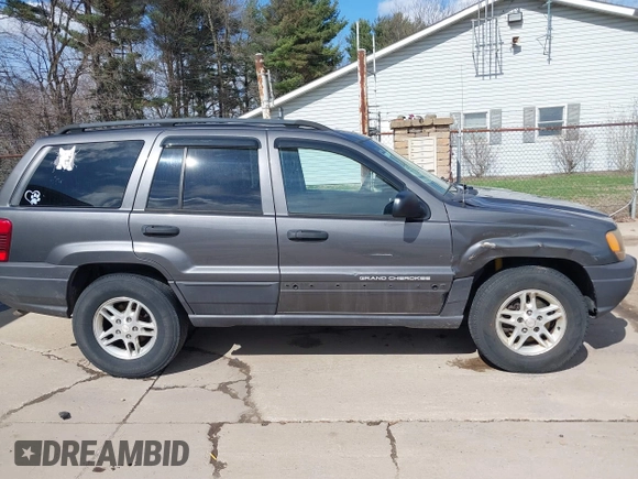 2003 Jeep Grand Cherokee Laredo with VIN 1J4GX48S53C504225, listed as a IAAI auction lot 41879669 with 247,246 mi miles. Bid and sale history available at carsss.com. Image 14.