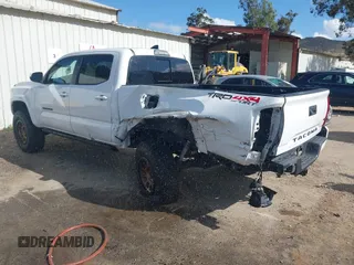 2018 Toyota Tacoma SR5 with VIN 3TMDZ5BN2JM037580, listed as a IAAI auction lot 42248418 with 35,661 mi miles and . Bid and sale history available at DreamBid. Image 3.