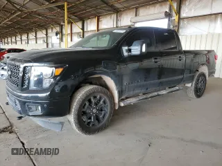 2019 Nissan Titan XD SL with VIN 1N6BA1F47KN534864, listed as a Copart auction lot 65651974 with 79,230 mi miles and Salvage Title. Bid and sale history available at carsss.com. Image 1.