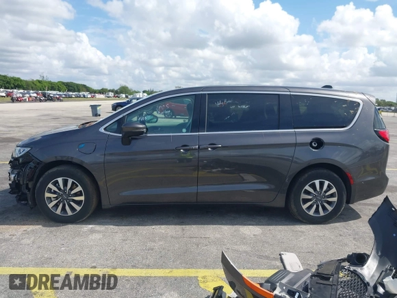 2023 Chrysler Pacifica Hybrid Touring L with VIN 2C4RC1L74PR579782, listed as a IAAI auction lot 42487390 with Not provided miles and . Bid and sale history available at DreamBid. Image 15.