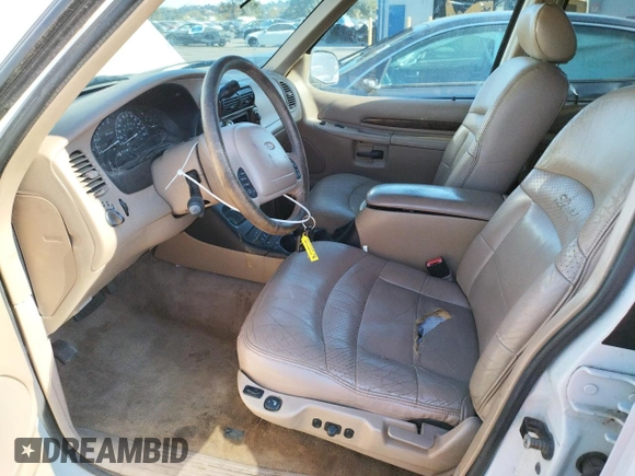 1999 Ford Explorer XLT with VIN 1FMZU34E8XZB27387, listed as a Copart auction lot 74398364 with 211,520 mi miles and Clean title. Bid and sale history available at DreamBid. Image 7.
