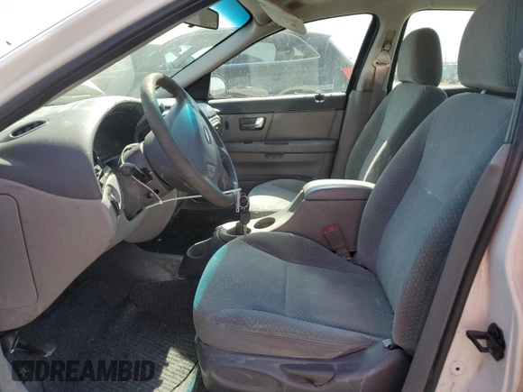 2000 Ford Taurus LX with VIN 1FAFP5222YA168638, listed as a Copart auction lot 60710415 with 119,948 mi miles and Salvage title. Bid and sale history available at DreamBid. Image 7.