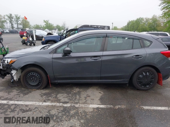 2019 Subaru Impreza with VIN 4S3GTAA69K1711062, listed as a IAAI auction lot 42187136 with 91,423 mi miles and . Bid and sale history available at DreamBid. Image 14.