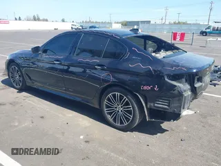 2018 BMW 5 Series 530e xDrive with VIN WBAJB1C51JB374308, listed as a IAAI auction lot 41965038 with 122,791 mi miles and . Bid and sale history available at carsss.com. Image 3.