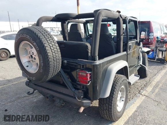 2003 Jeep Wrangler Sport with VIN 1J4FA49S23P328867, listed as a IAAI auction lot 41354414 with 96,703 mi miles. Bid and sale history available at carsss.com. Image 4.