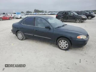 2000 Hyundai Elantra GLS z VIN KMHJF35F9YU032902, wystawiony jako Copart lot #45145955 z przebiegiem 79 229 mil mil oraz Czysty tytuł • Clean title. Historia ofert i sprzedaży dostępna na DreamBid. Obrazek 4.