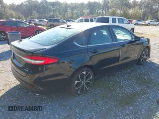 2018 Ford Fusion SE with VIN 3FA6P0LU7JR138906, listed as a IAAI auction lot 41573985 with 127,660 mi miles and . Bid and sale history available at DreamBid. Image 4.