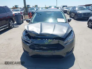 2018 Ford Focus SE with VIN 1FADP3FE3JL204220, listed as a IAAI auction lot 41972960 with 62,682 mi miles and . Bid and sale history available at DreamBid. Image 12.