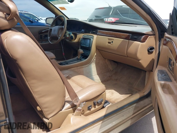 1999 Cadillac Eldorado ESC z VIN 1G6EL12Y5XU603764, wystawiony jako IAAI lot #42368692 z przebiegiem 154 613 mil mil oraz . Historia ofert i sprzedaży dostępna na DreamBid. Obrazek 5.