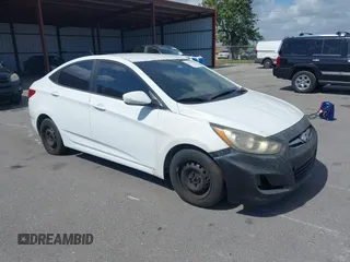 2014 Hyundai Accent GLS with VIN KMHCT4AE1EU590386, listed as a IAAI auction lot 42155202 with 248,545 mi miles. Bid and sale history available at carsss.com. Image 1.
