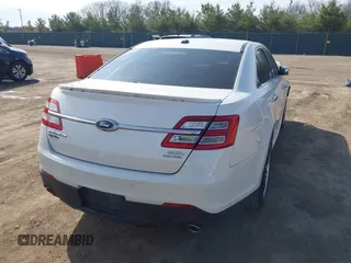 2015 Ford Taurus SEL z VIN 1FAHP2E86FG202386, wystawiony jako IAAI lot #42061925 z przebiegiem 123 475 mil mil oraz . Historia ofert i sprzedaży dostępna na DreamBid. Obrazek 4.