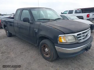 1999 Ford F-150 Work Series with VIN 1FTRX17W7XNC31381, listed as a IAAI auction lot 41734799 with 122,035 mi miles. Bid and sale history available at carsss.com. Image 1.