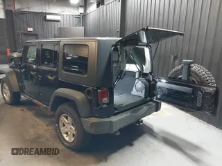2009 Jeep Wrangler Unlimited Rubicon z VIN 1J8GA69109L738914, wystawiony jako IAAI lot #40379001 z przebiegiem 120 153 mil mil oraz . Historia ofert i sprzedaży dostępna na DreamBid. Obrazek 3.