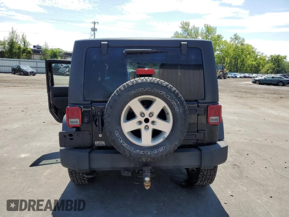 2014 Jeep Wrangler Sport with VIN 1C4AJWAG2EL113843, listed as a Copart auction lot 62771115 with 70,089 mi miles and Salvage title. Bid and sale history available at DreamBid. Image 6.