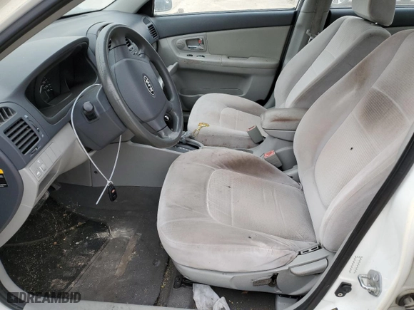 2008 Kia Spectra EX with VIN KNAFE121585499963, listed as a Copart auction lot 77143883 with 153,965 mi miles and Salvage Title. Bid and sale history available at carsss.com. Image 7.