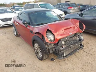 2015 MINI Coupe z VIN WMWSX1C54FT508123, wystawiony jako IAAI lot #40974103 z przebiegiem 79 035 mil mil oraz . Historia ofert i sprzedaży dostępna na DreamBid. Obrazek 1.