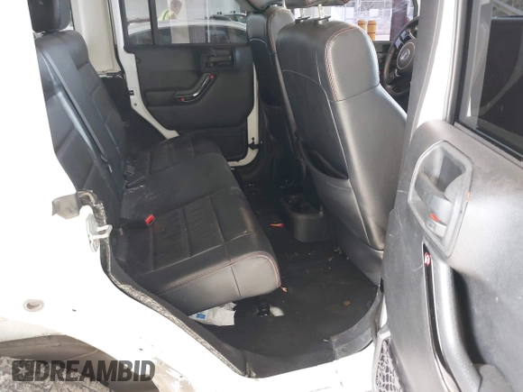 2012 Jeep Wrangler Unlimited Sahara with VIN 1C4BJWEG7CL275883, listed as a IAAI auction lot 42510764 with 149,531 mi miles and . Bid and sale history available at DreamBid. Image 8.
