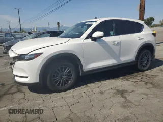 2021 Mazda CX-5 Touring z VIN JM3KFBCM1M1491946, wystawiony jako Copart lot #51637245 z przebiegiem 57 332 mil mil oraz Szkoda całkowita • Salvage title. Historia ofert i sprzedaży dostępna na DreamBid. Obrazek 1.