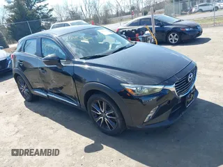 2018 Mazda CX-3 Grand Touring z VIN JM1DKFD75J0312662, wystawiony jako IAAI lot #41805287 z przebiegiem 140 083 mil mil oraz . Historia ofert i sprzedaży dostępna na DreamBid. Obrazek 1.