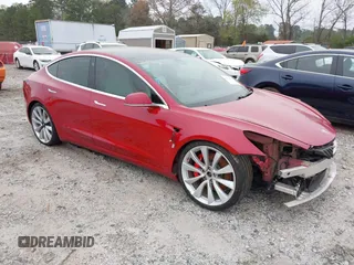 2018 Tesla Model 3 Long Range Battery with VIN 5YJ3E1EB7JF055384, listed as a IAAI auction lot 41924325 with 52,039 mi miles and . Bid and sale history available at DreamBid. Image 1.
