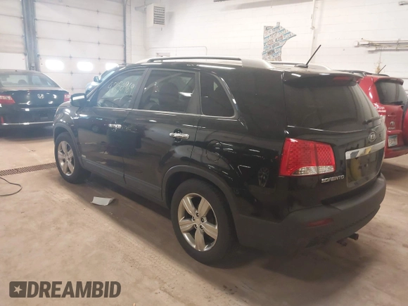 2012 Kia Sorento EX with VIN 5XYKUDA67CG306585, listed as a IAAI auction lot 42150969 with 128,792 mi miles. Bid and sale history available at carsss.com. Image 3.