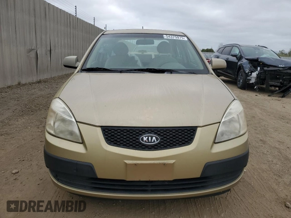 2009 Kia Rio LX with VIN KNADE223496549097, listed as a Copart auction lot 54375975 with 140,882 mi miles and Salvage Title. Bid and sale history available at DreamBid. Image 5.