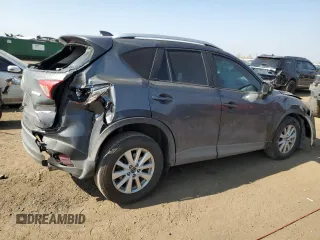 2014 Mazda CX-5 Sport z VIN JM3KE4BE1E0359446, wystawiony jako Copart lot #54562545 z przebiegiem 128 150 mil mil oraz Szkoda całkowita • Salvage title. Historia ofert i sprzedaży dostępna na DreamBid. Obrazek 3.