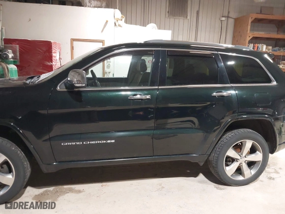 2014 Jeep Grand Cherokee Overland with VIN 1C4RJFCGXEC162109, listed as a IAAI auction lot 41943979 with 147,788 mi miles. Bid and sale history available at carsss.com. Image 15.