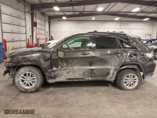 2018 Jeep Grand Cherokee Laredo E with VIN 1C4RJFAG4JC313054, listed as a IAAI auction lot 41469450 with 142,929 mi miles. Bid and sale history available at carsss.com. Image 15.