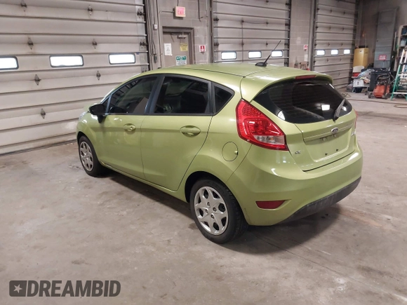 2013 Ford Fiesta SE with VIN 3FADP4EJ9DM131913, listed as a IAAI auction lot 41677333 with 54,673 mi miles. Bid and sale history available at carsss.com. Image 3.