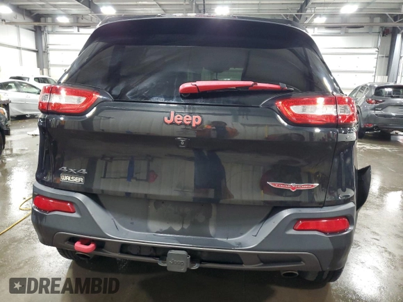2015 Jeep Cherokee Trailhawk with VIN 1C4PJMBS5FW587545, listed as a Copart auction lot 58820685 with 136,755 mi miles and Salvage title. Bid and sale history available at DreamBid. Image 6.