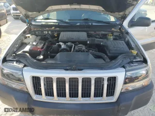 2004 Jeep Grand Cherokee Laredo with VIN 1J4GX48N74C406647, listed as a Copart auction lot 77631654 with 174,824 mi miles and Salvage Title. Bid and sale history available at carsss.com. Image 12.