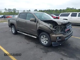 2015 GMC Canyon 2WD SLE with VIN 1GTG5BE38F1229799, listed as a IAAI auction lot 41944801 with 71,165 mi miles. Bid and sale history available at carsss.com. Image 1.